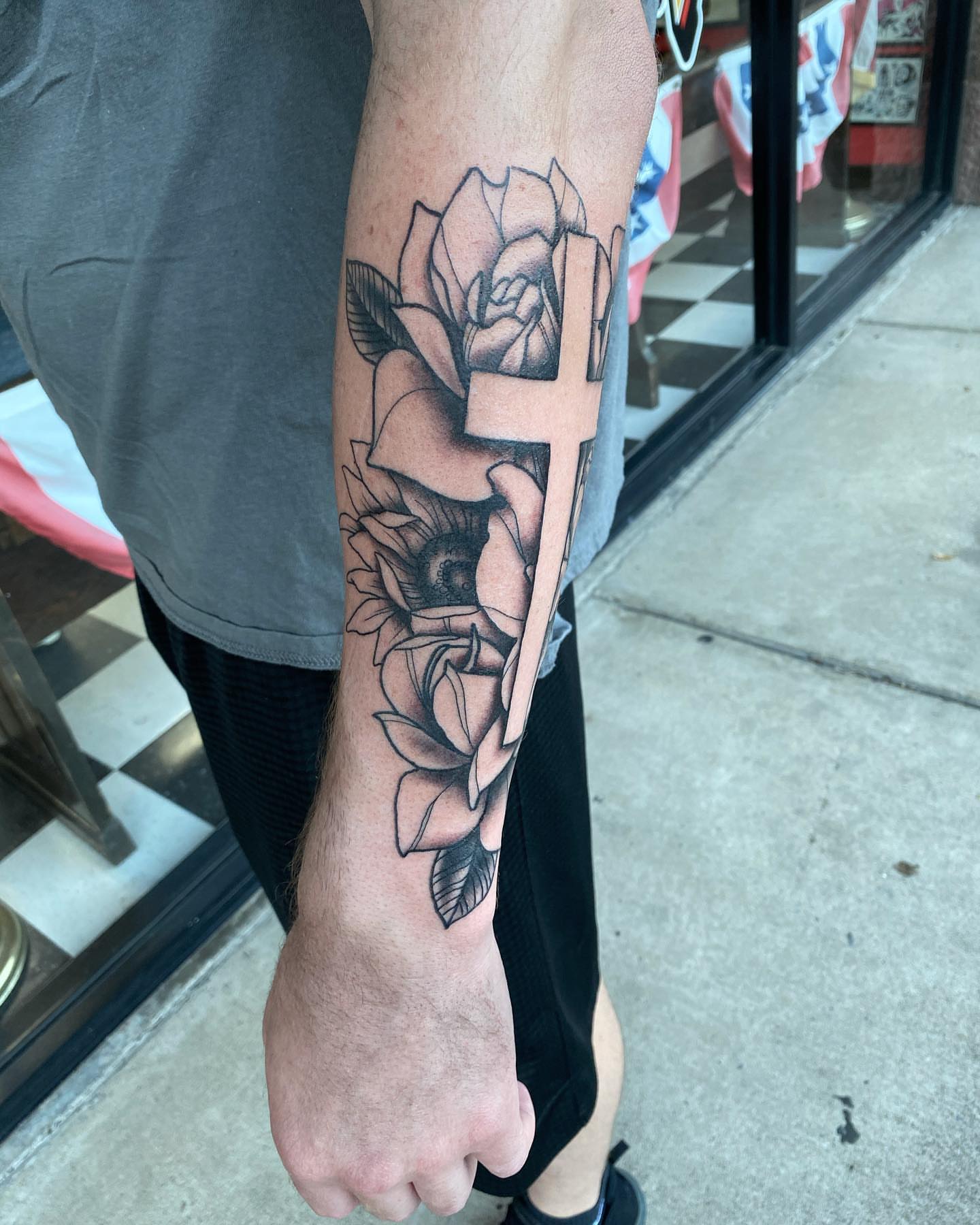 Cross and roses black and grey tattoo on the forearm by Jake Snoddy, Franklin, Tennessee