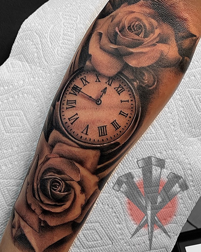 Clock and roses realism tattoo on the forearm by George Weibe