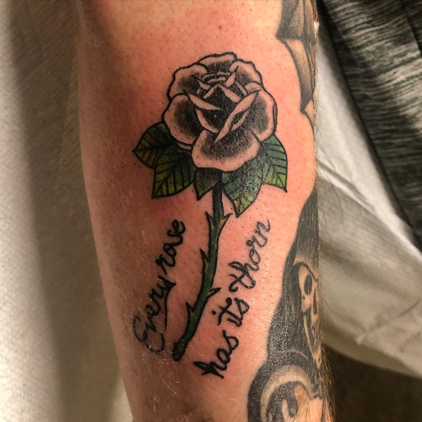 Rose black and grey tattoo on the forearm by Sally Darling