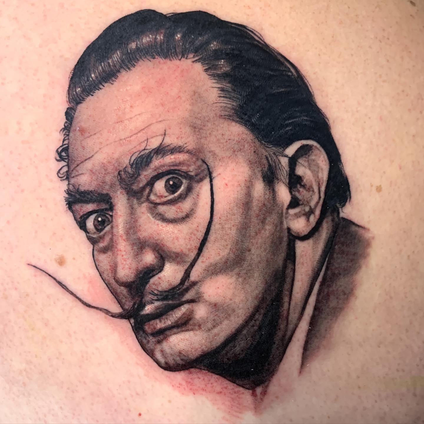 Salvador dali realism tattoo on the back by Albuquerque Tattoo Artist, Albuquerque, New Mexico