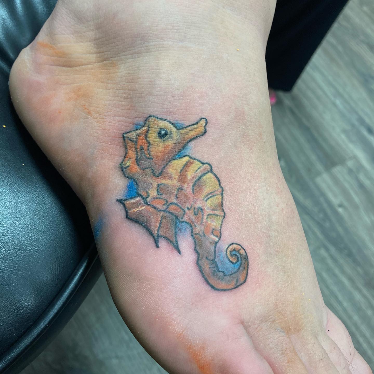 Seahorse realism tattoo on the foot by Dre Inks
