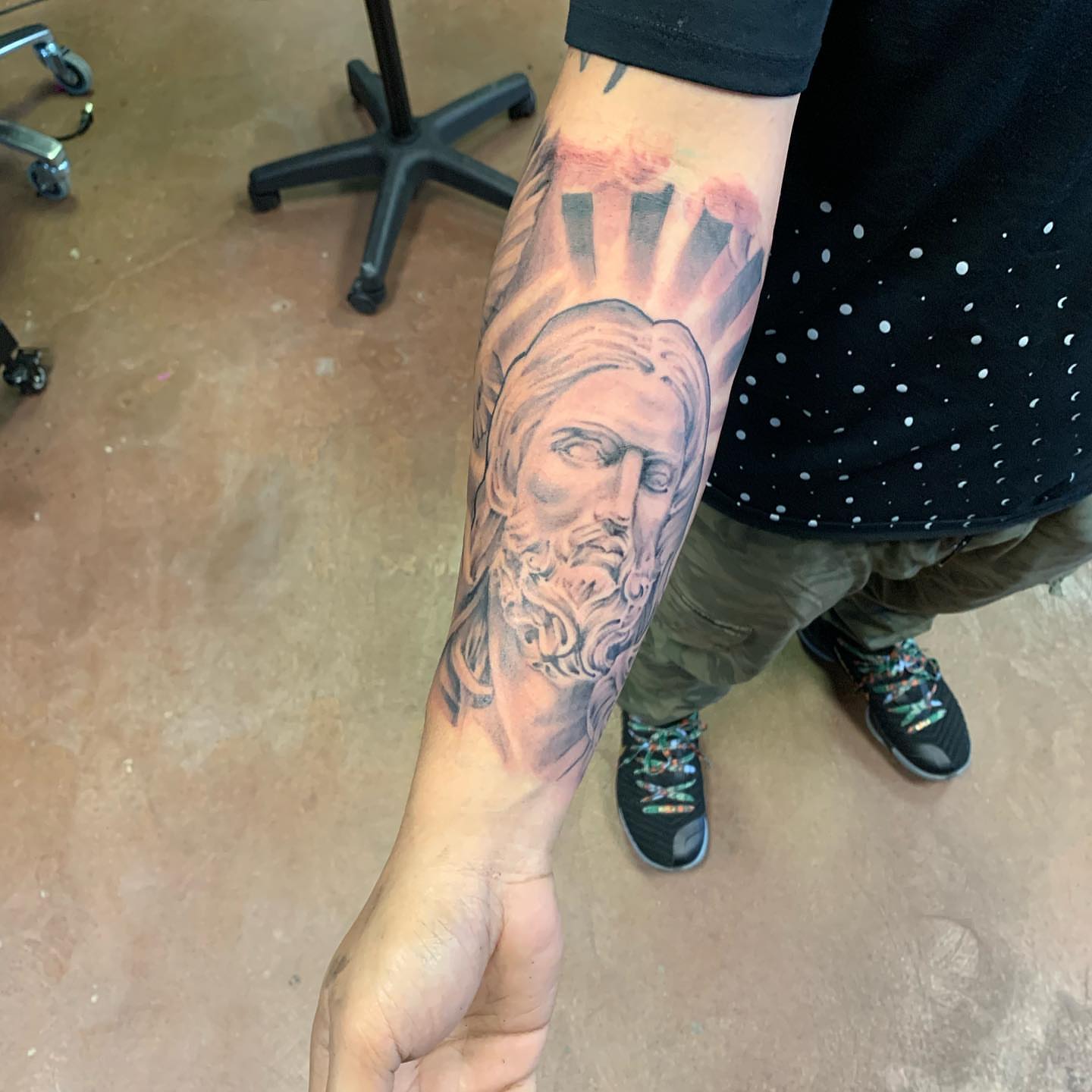 God-like figure realism tattoo on the forearm by Mikeyftsk2
