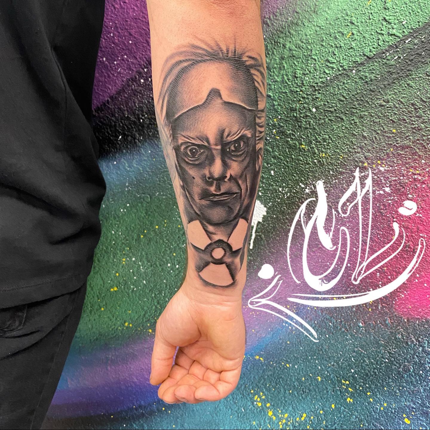 Portrait realism tattoo on the forearm by Labbé