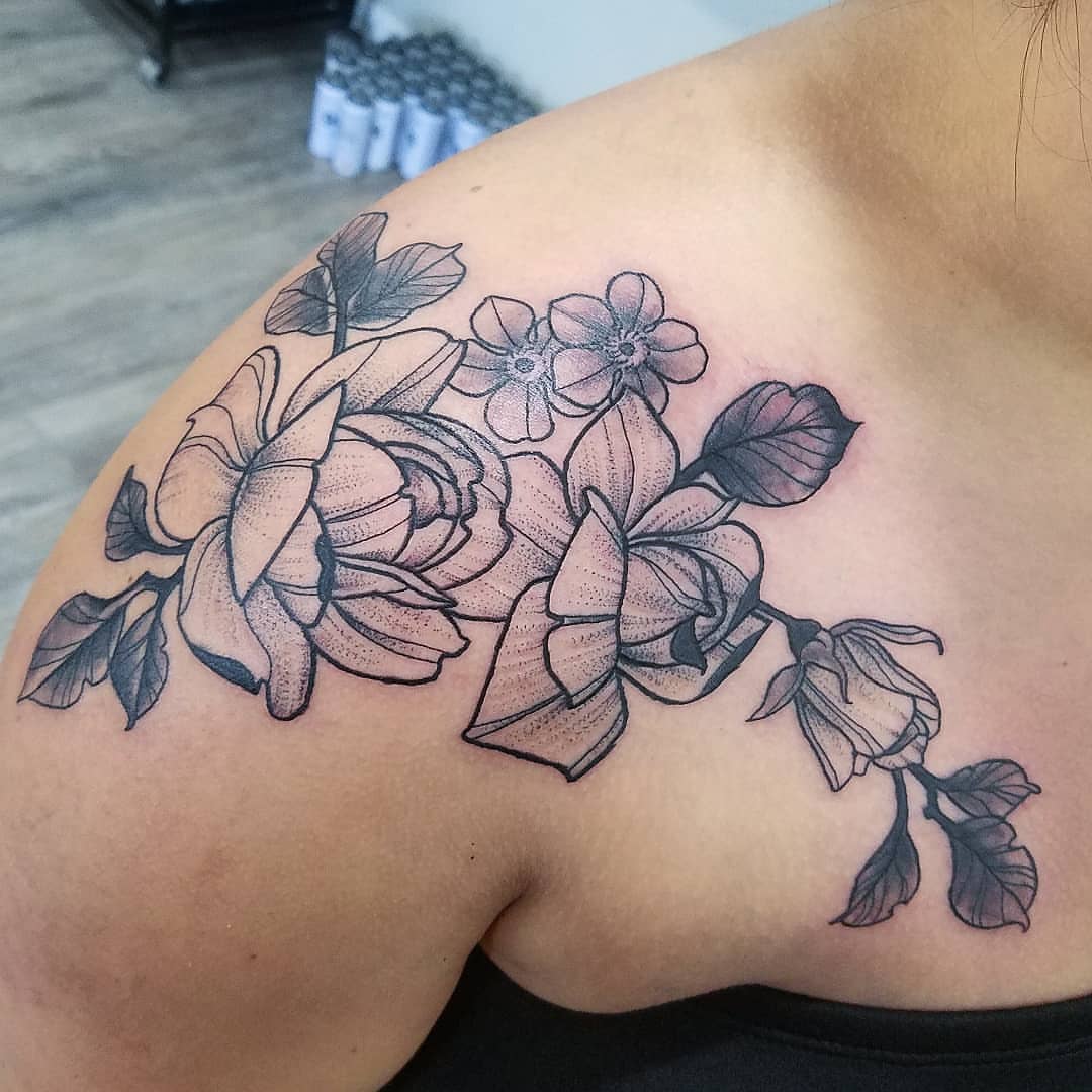 Flower bouquet dotwork tattoo on the shoulder by Dick Eckman