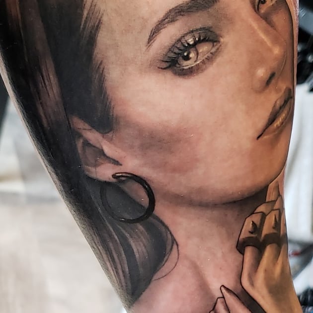 Portrait realism tattoo on the forearm by @doctorze