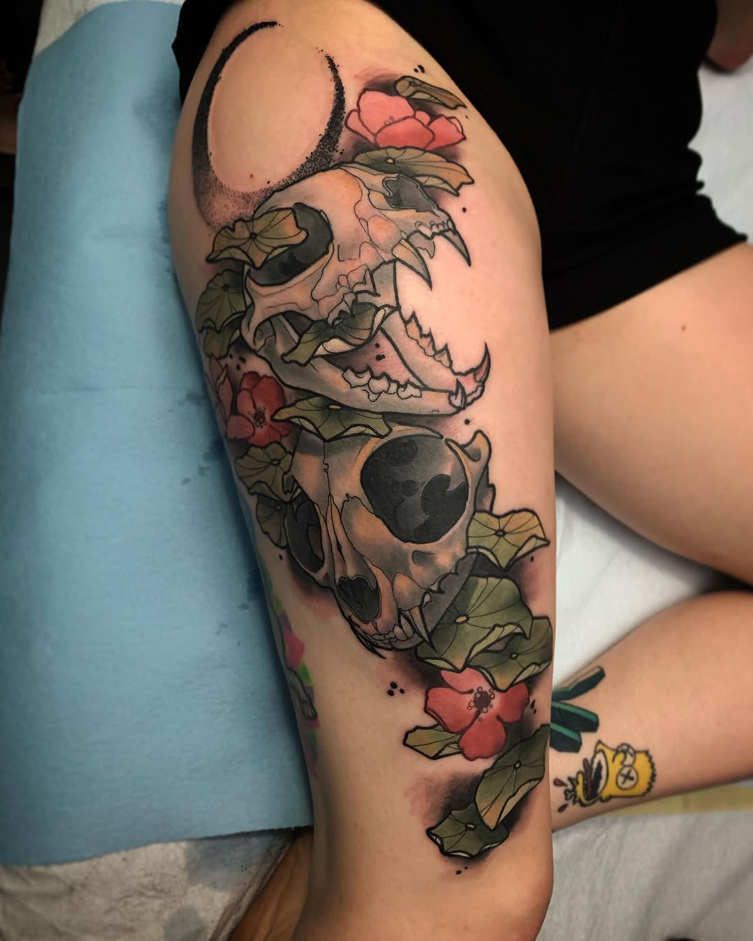 Animal skulls with flowers realism tattoo on the thigh by Brandon Michael