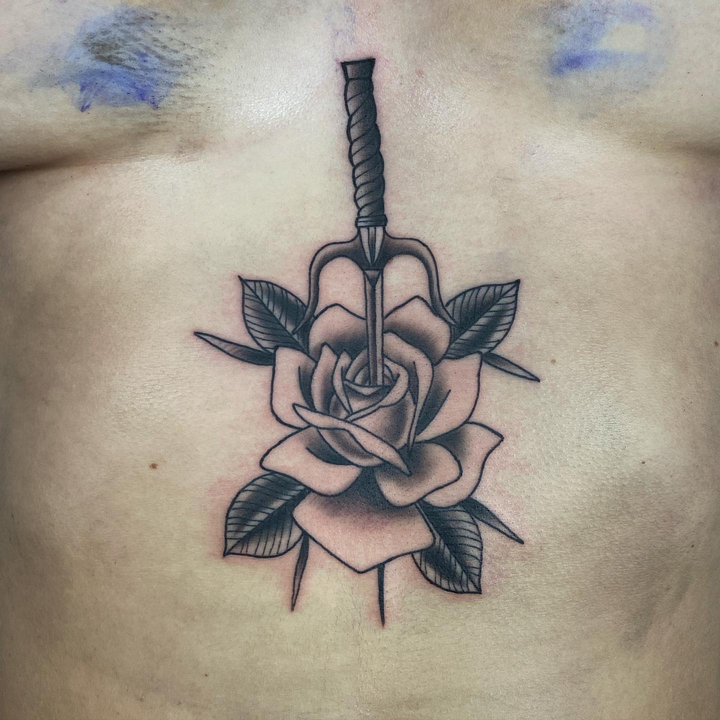 Sword through rose American traditional tattoo on the chest by Jake Snoddy, Franklin, Tennessee