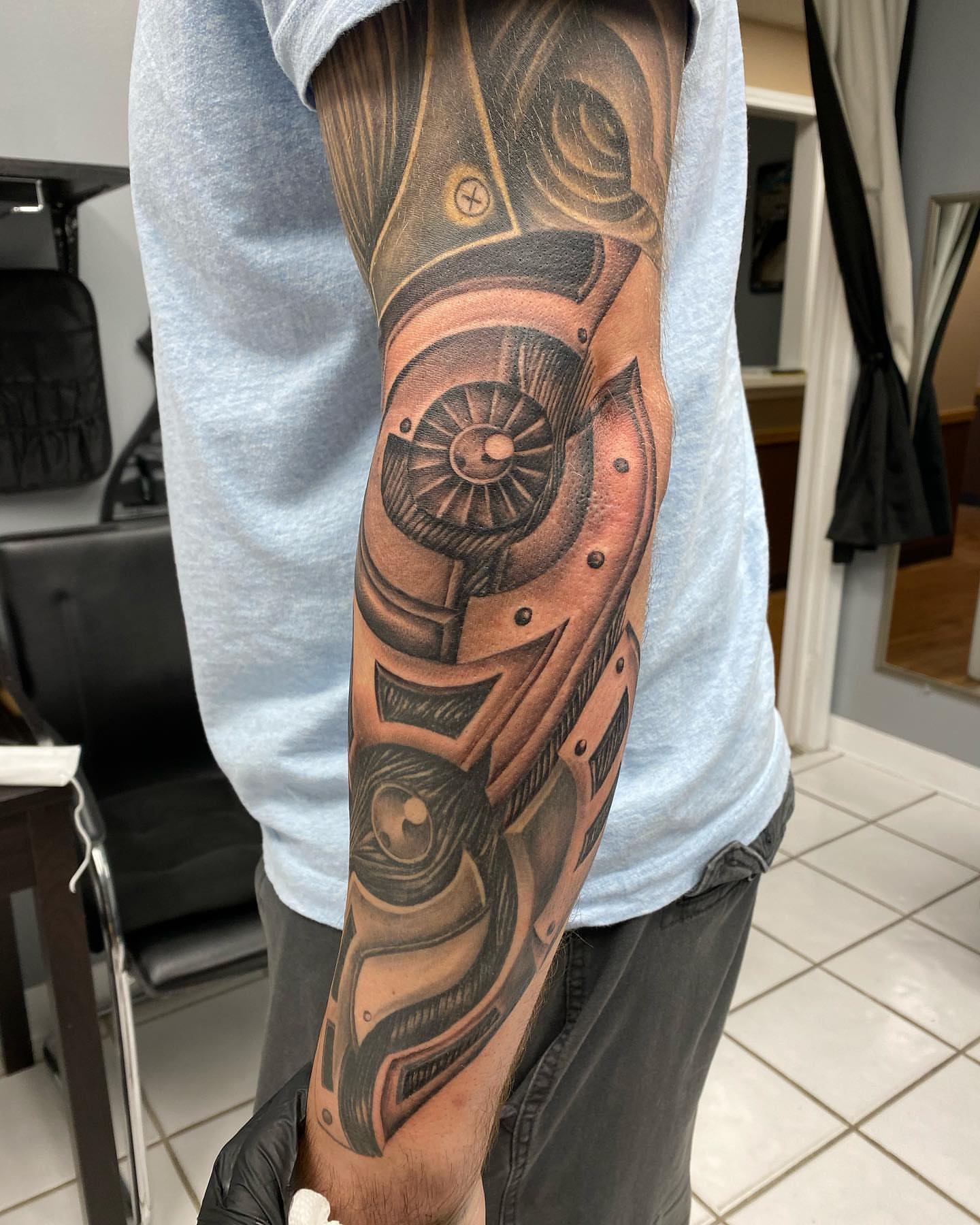 Mechanical gear geometric tattoo on the forearm by mike hudson