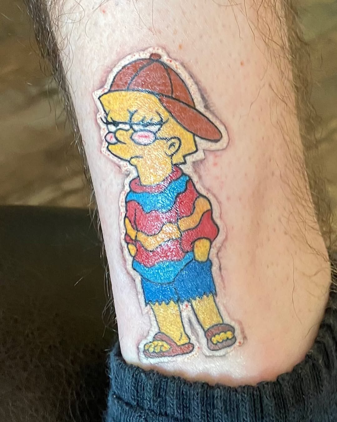 Lisa Simpson character new school tattoo on the forearm by Chris