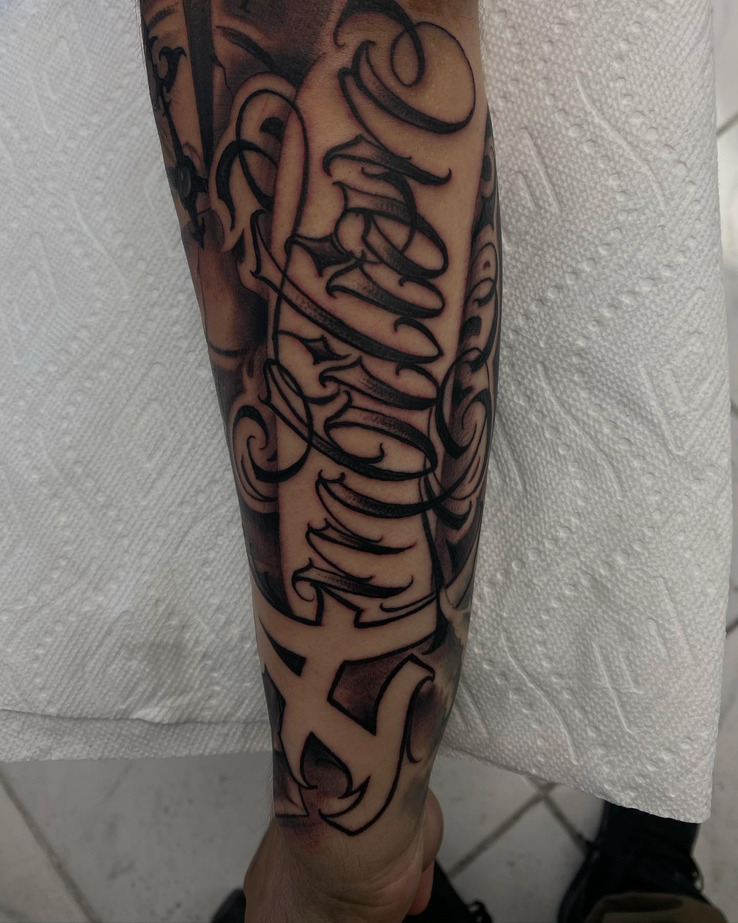 Script lettering lettering script tattoo on the forearm by Tattoos By Chino