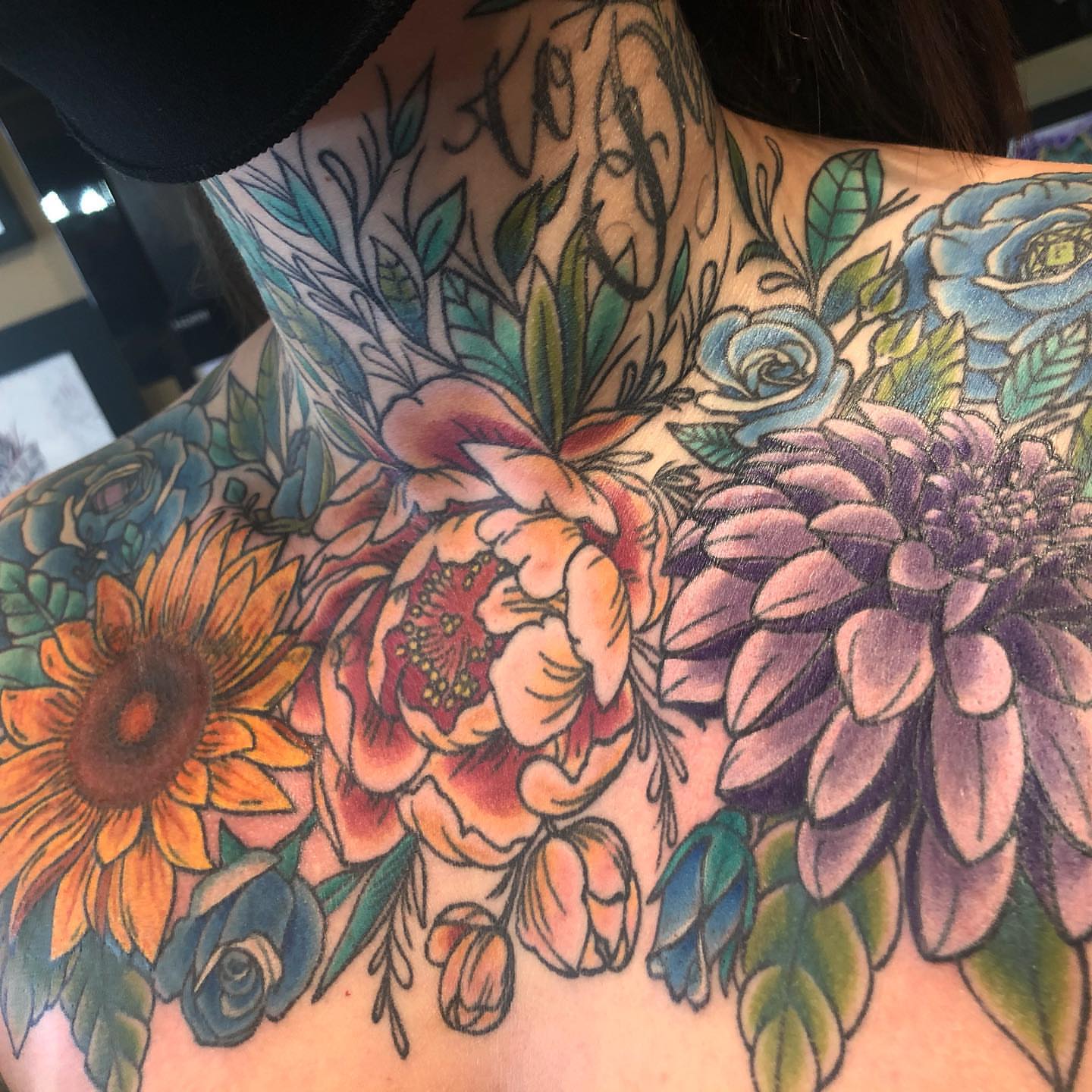 Floral bouquet new school tattoo on the shoulder by alexandra