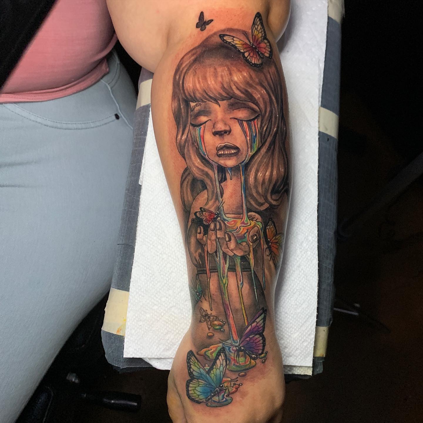 Melting girl with butterflies realism tattoo on the forearm by Albuquerque Tattoo Artist, Albuquerque, New Mexico
