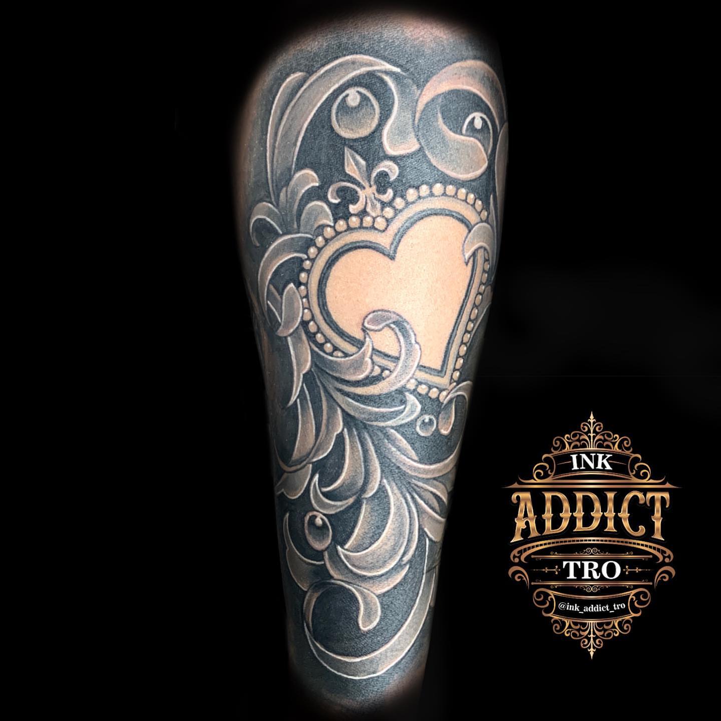 Heart with floral ornamentation ornamental tattoo on the forearm by Trocon Talhouk