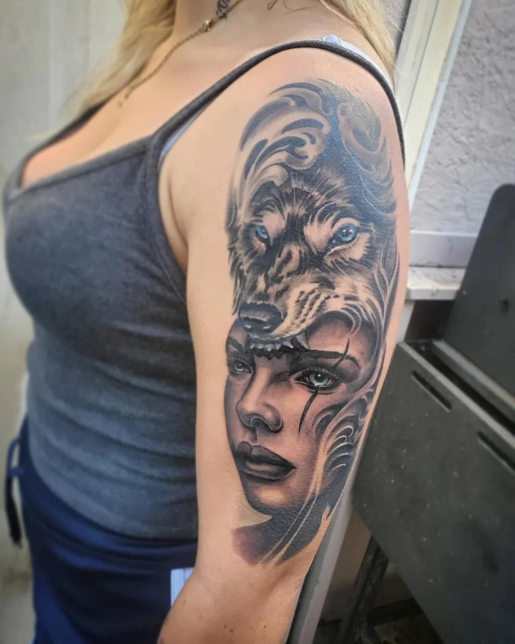 Wolf and woman realism tattoo on the shoulder by David Xavier Jimenez