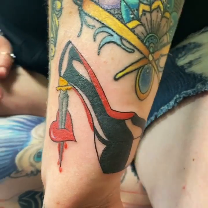 High heel and dagger neo-traditional tattoo by Sally Darling