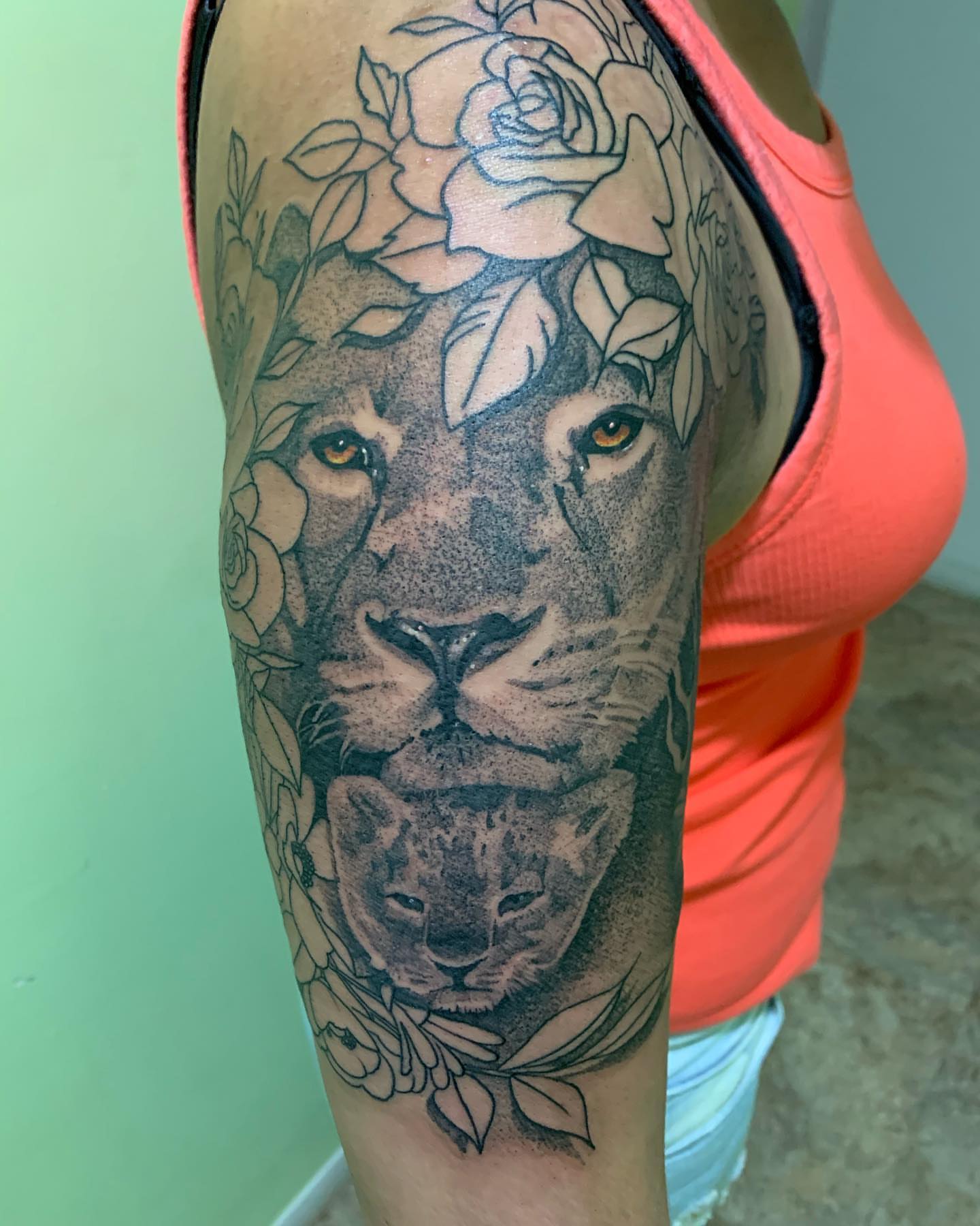 Lion family dotwork tattoo on the upper arm by TattoozbyAlexander