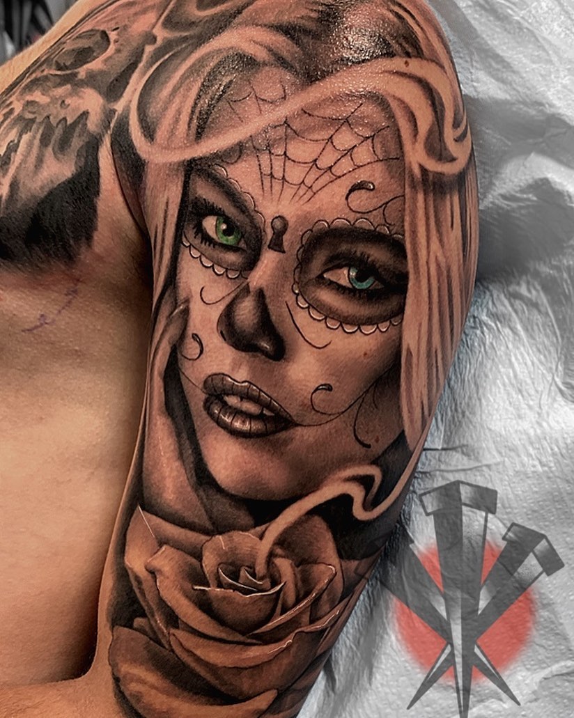 Sugar skull woman realism tattoo on the shoulder by George Weibe