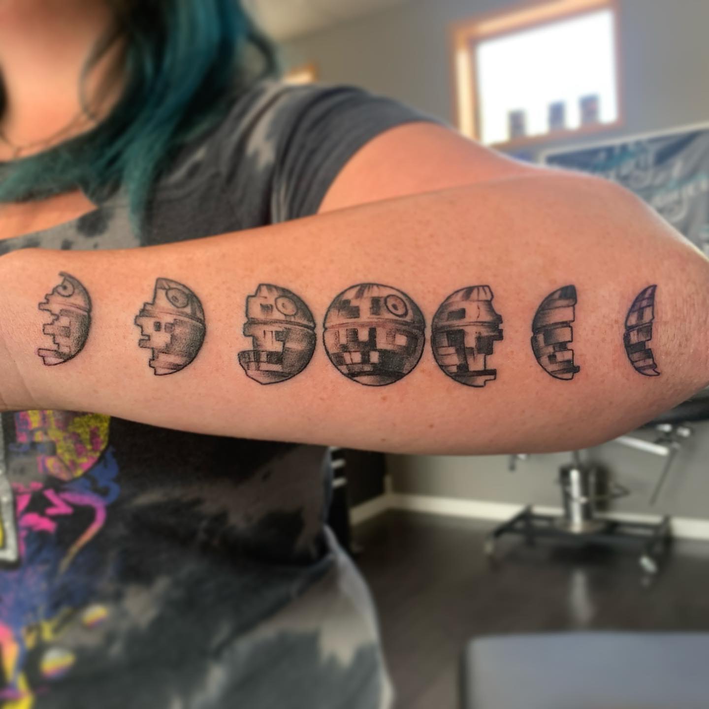 Robot heads black and grey tattoo on the forearm by Paul Hicks