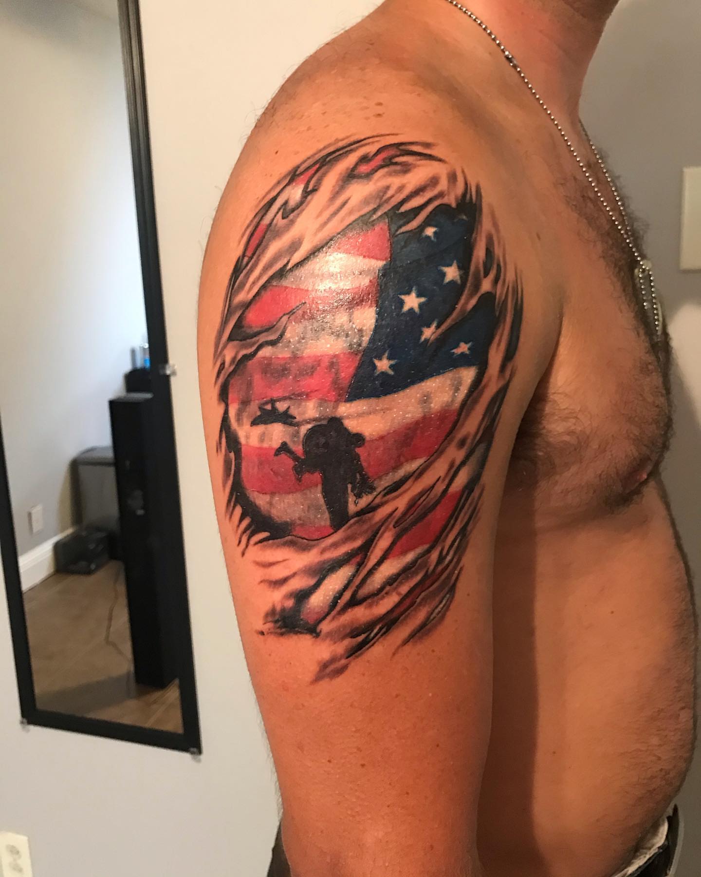 American flag American traditional tattoo on the shoulder by Christopher McGlone