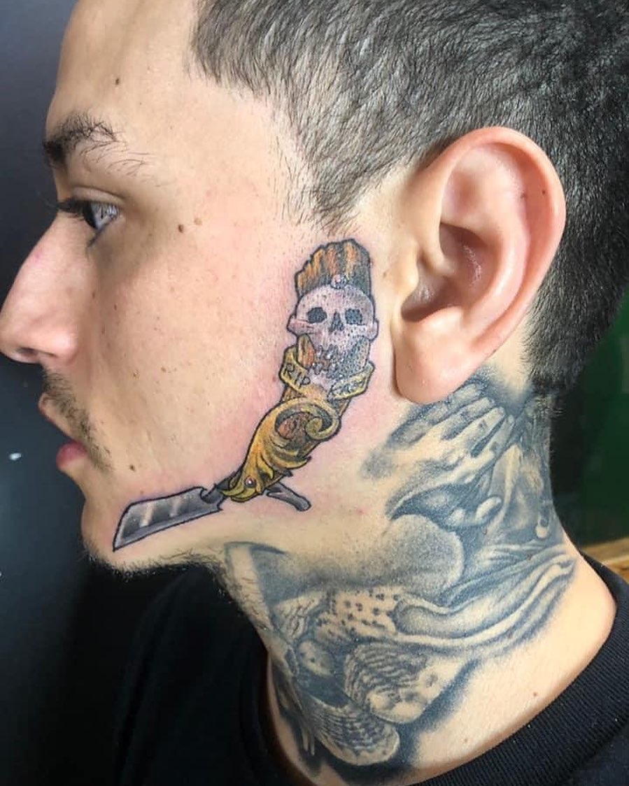 Skull with straight razor American traditional tattoo on the neck by Chris