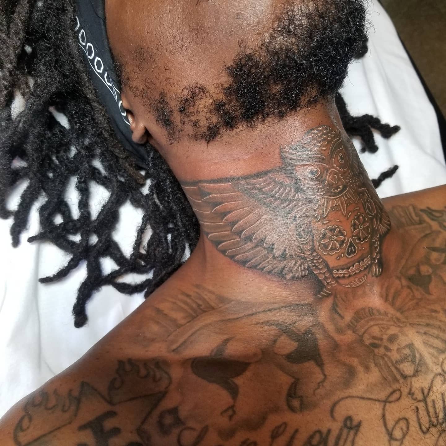 Owl black and grey tattoo on the neck by Miguel-C, Houston, Texas