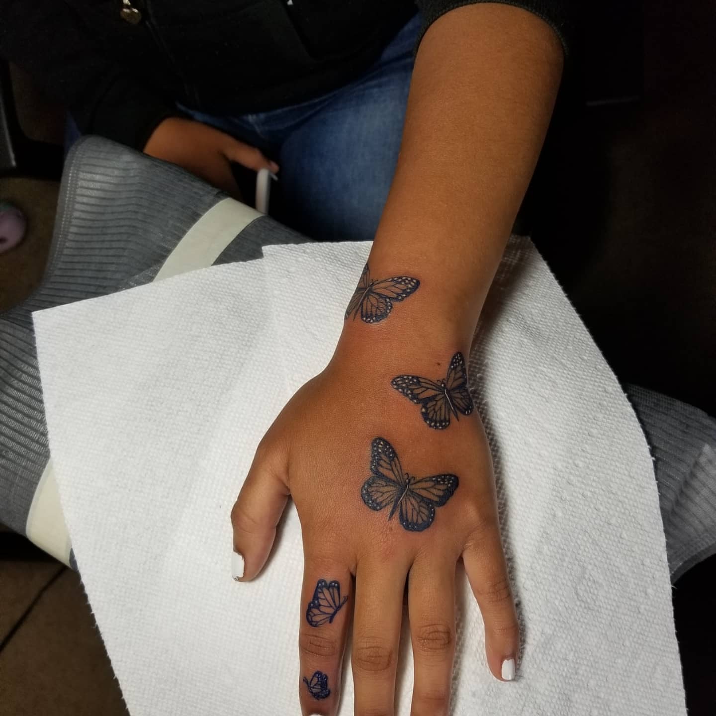 Butterflies black and grey tattoo on the hand by Miguel-C, Houston, Texas