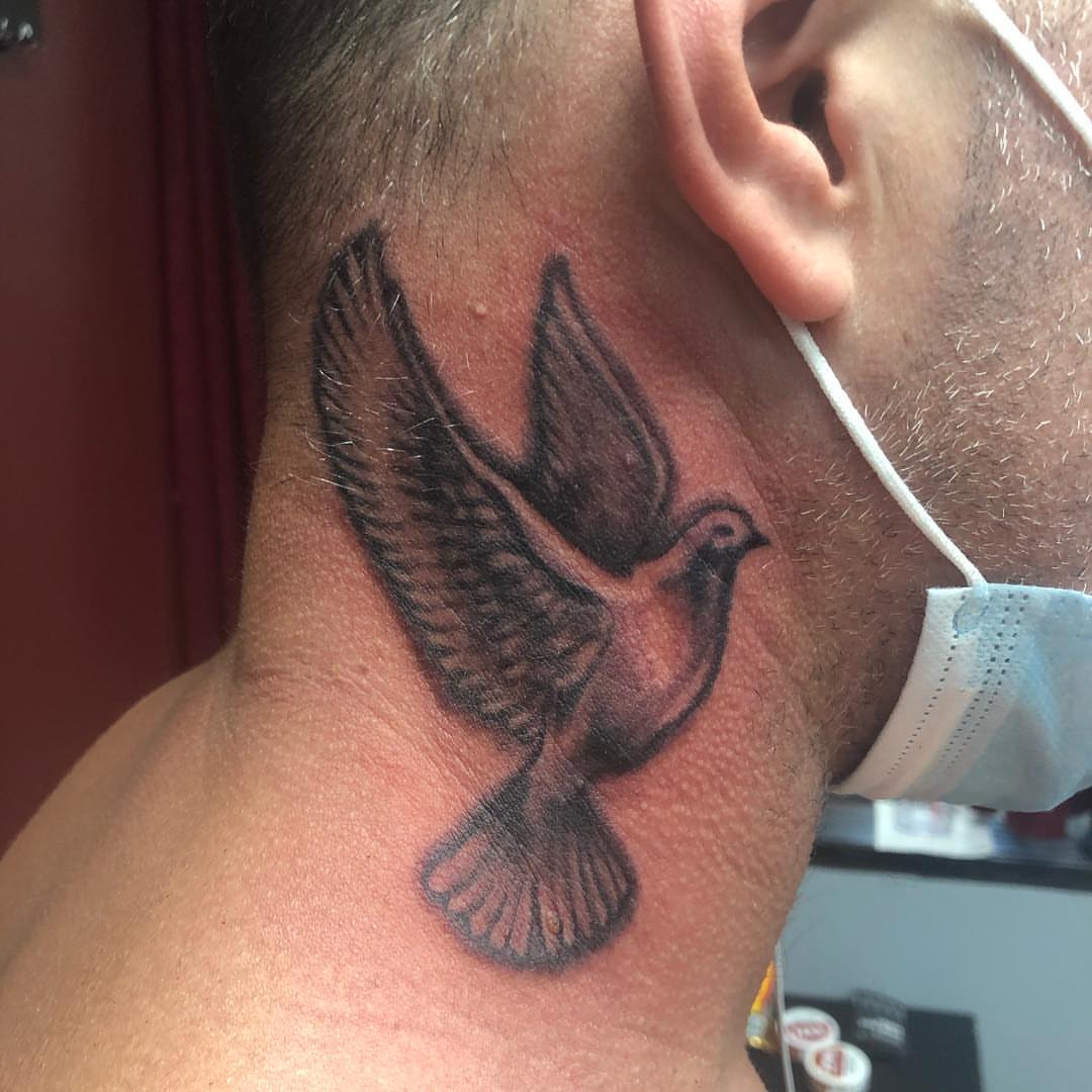 Bird black and grey tattoo on the neck by KJ