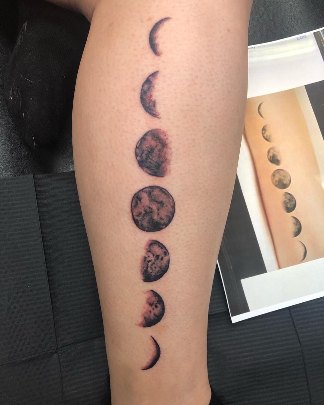 Moon phases realism tattoo on the forearm by KJ