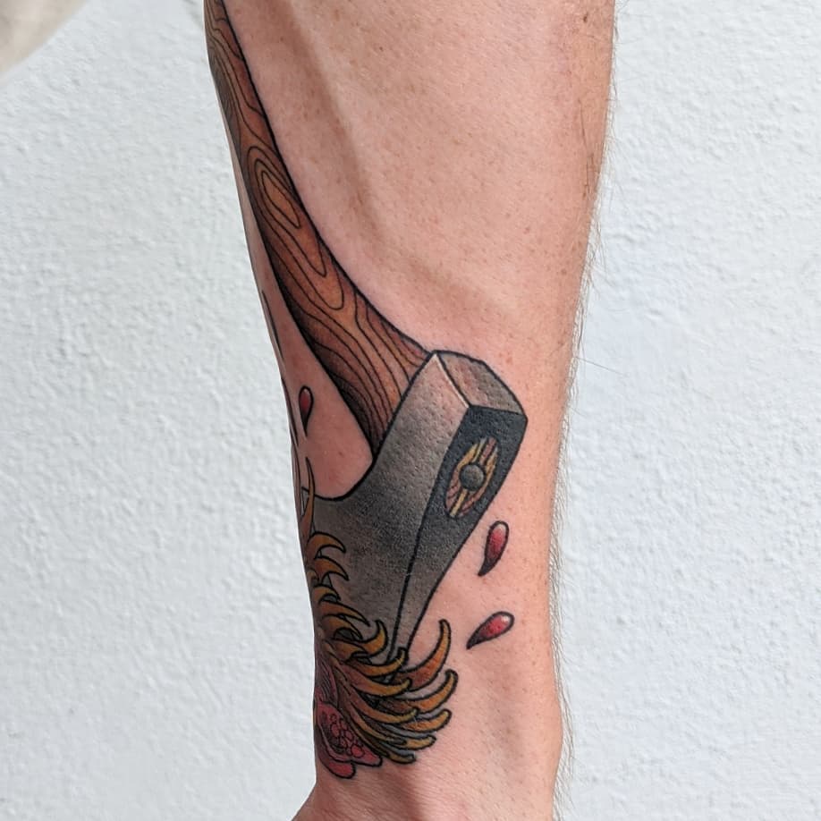Wooden hammer geometric tattoo on the forearm by Christel Perkins