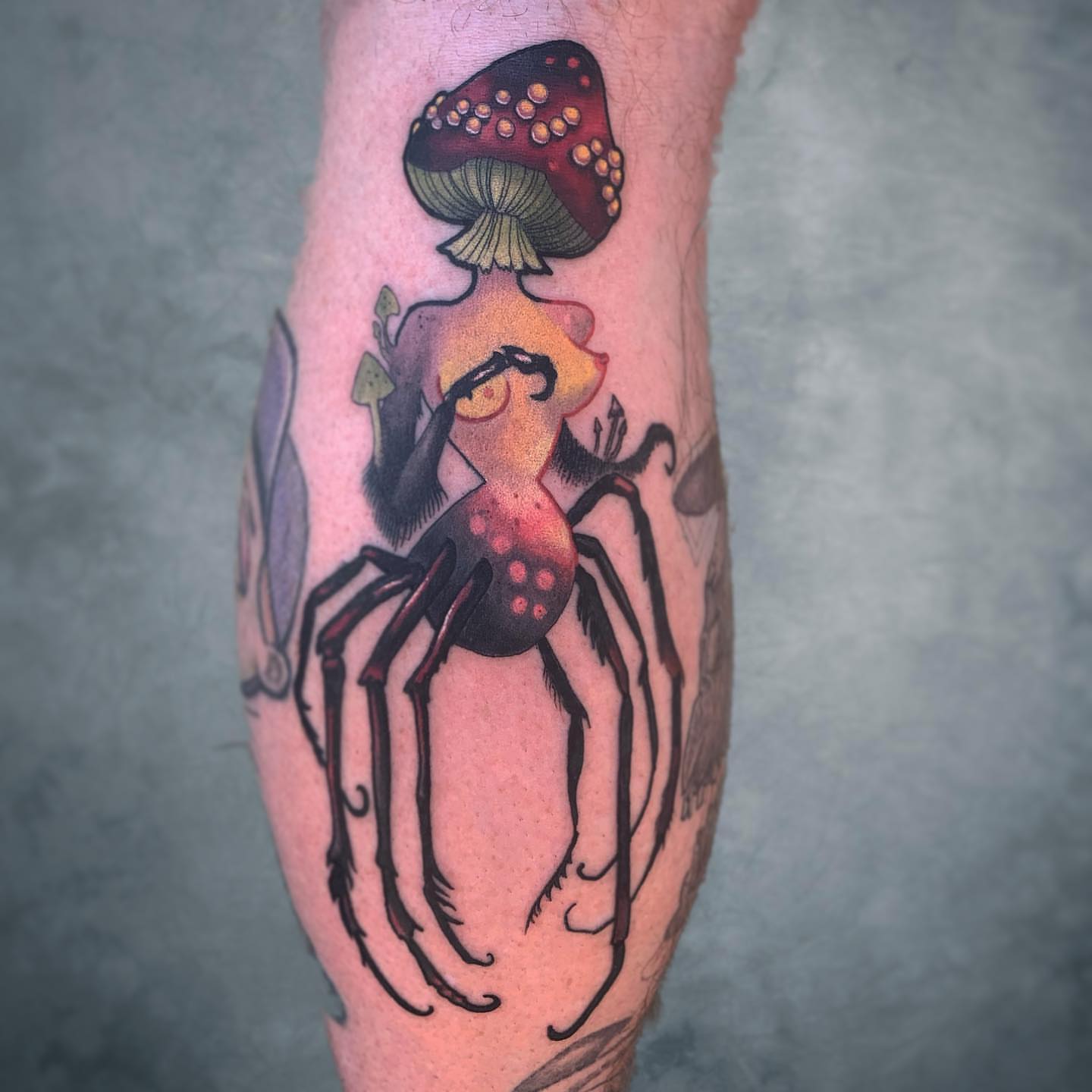 Mushroom and spider dotwork tattoo on the forearm by Briana Walker
