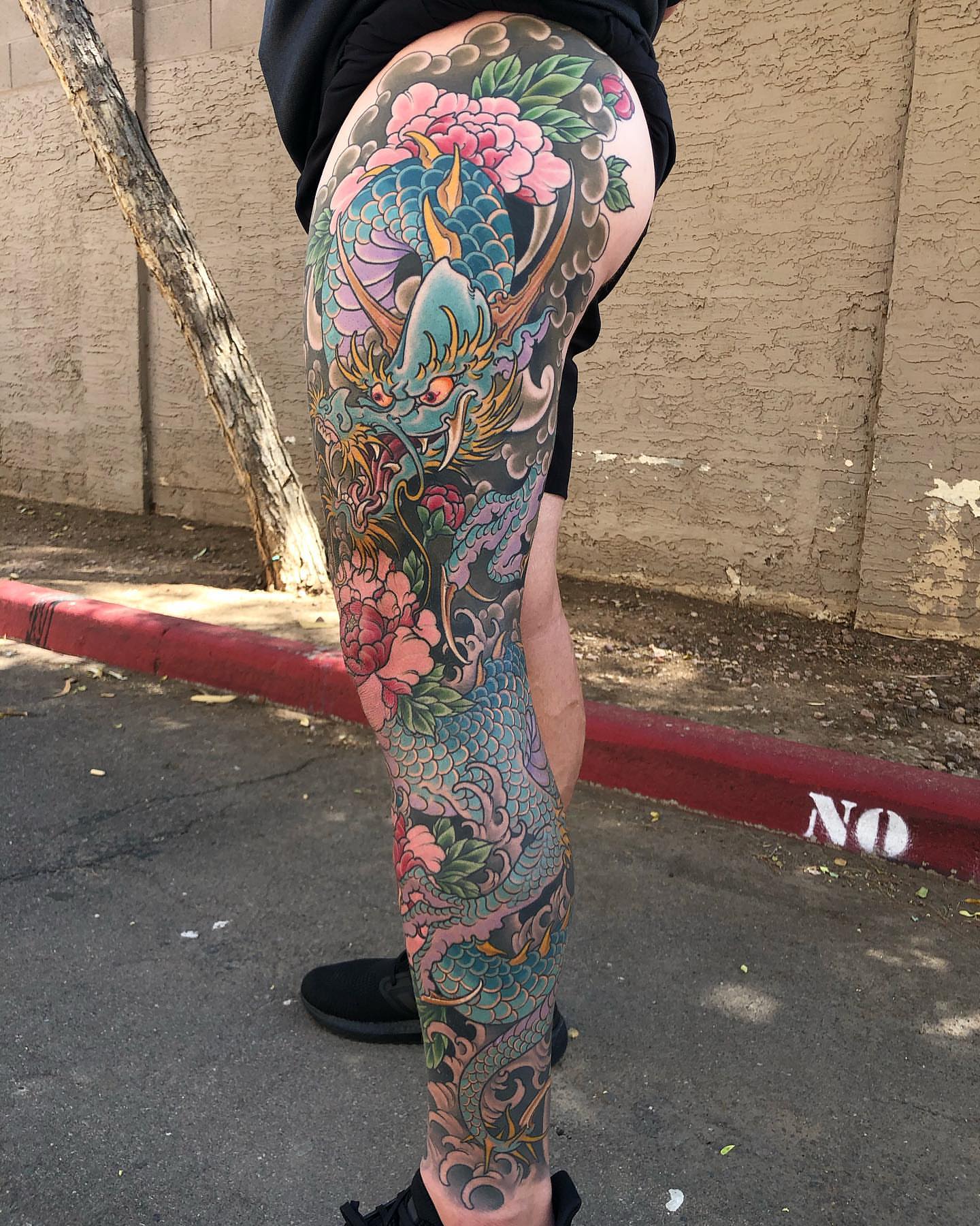 Dragon and flowers japanese irezumi tattoo on the thigh by Byron Winkelman, Gilbert, Arizona