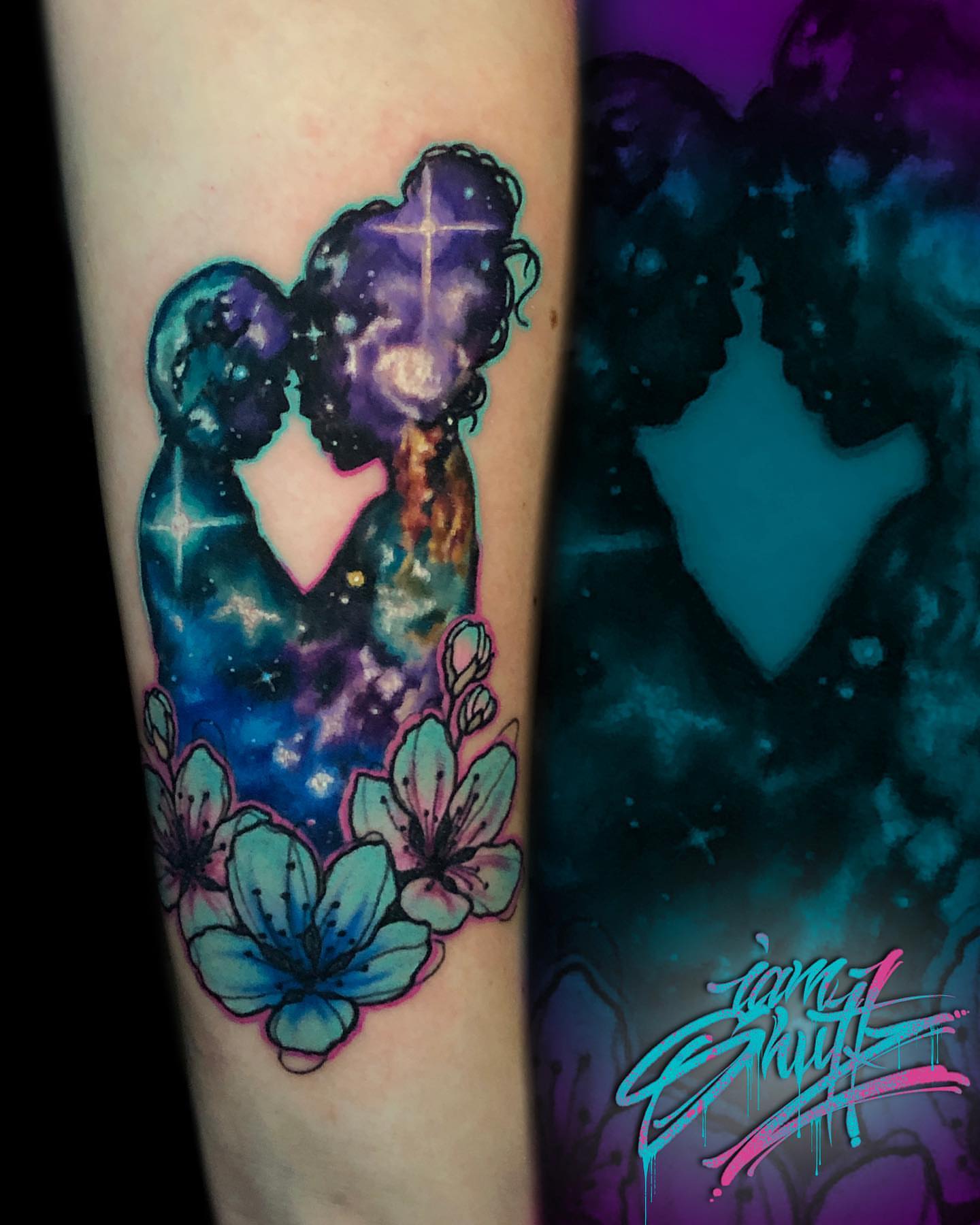 Galaxy couple with flowers watercolor tattoo on the forearm by Mike Shultz