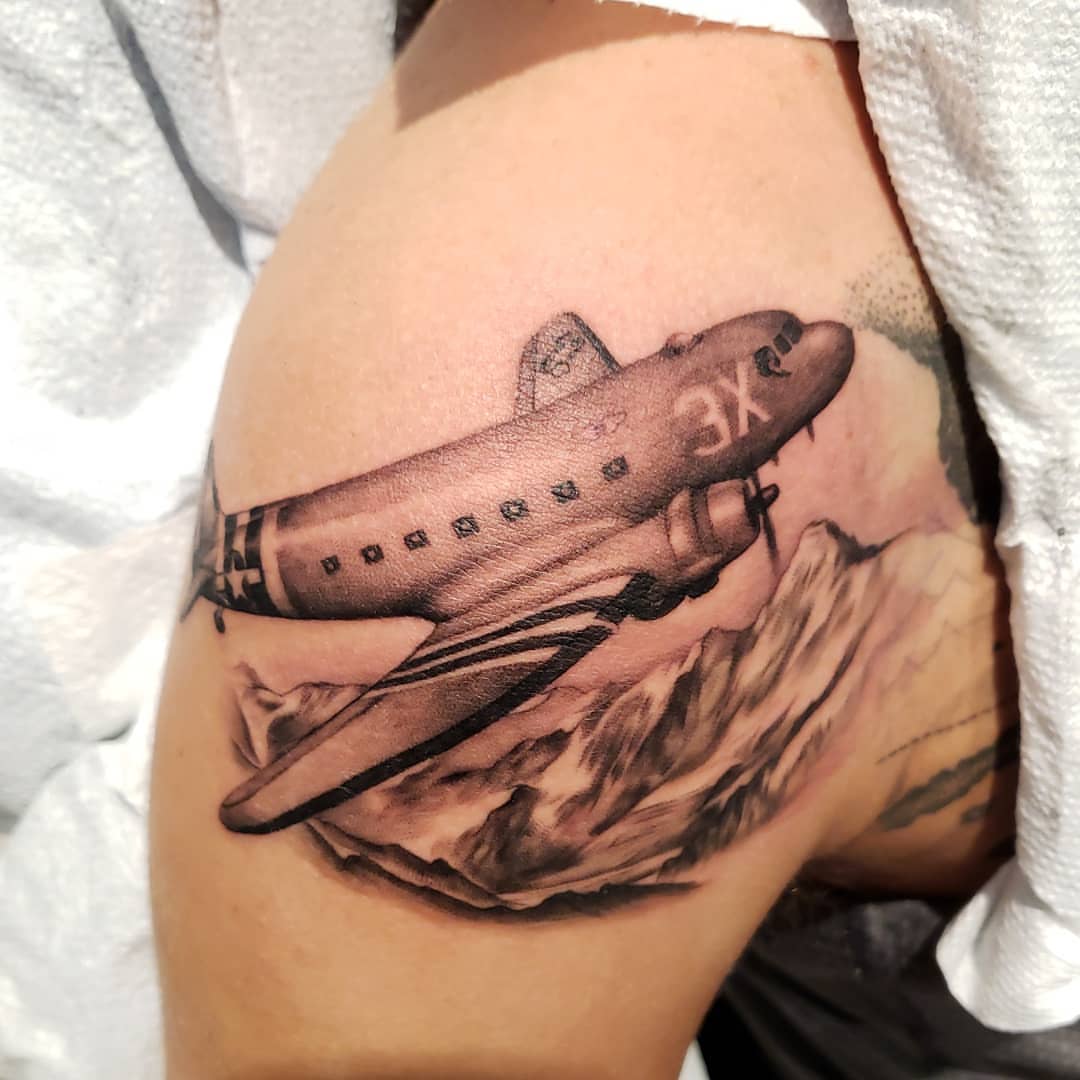 Airplane realism tattoo on the thigh by @doctorze