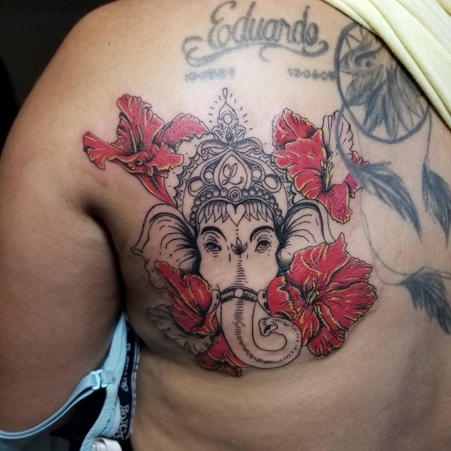 Ganesha with flowers neo-traditional tattoo on the shoulder by Miguel-C, Houston, Texas