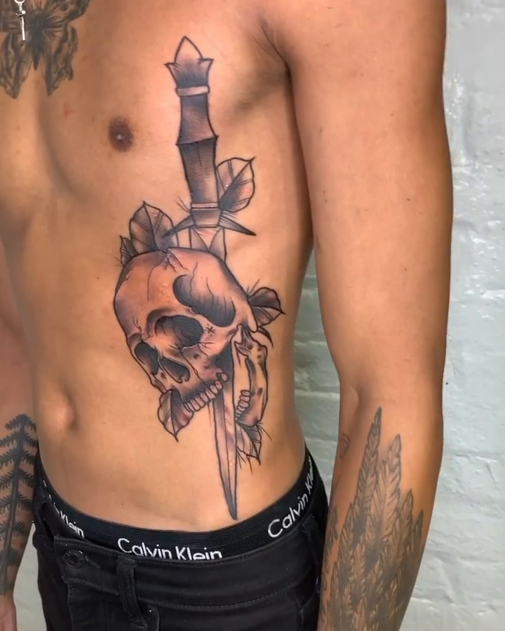 Skull and dagger realism tattoo by E
