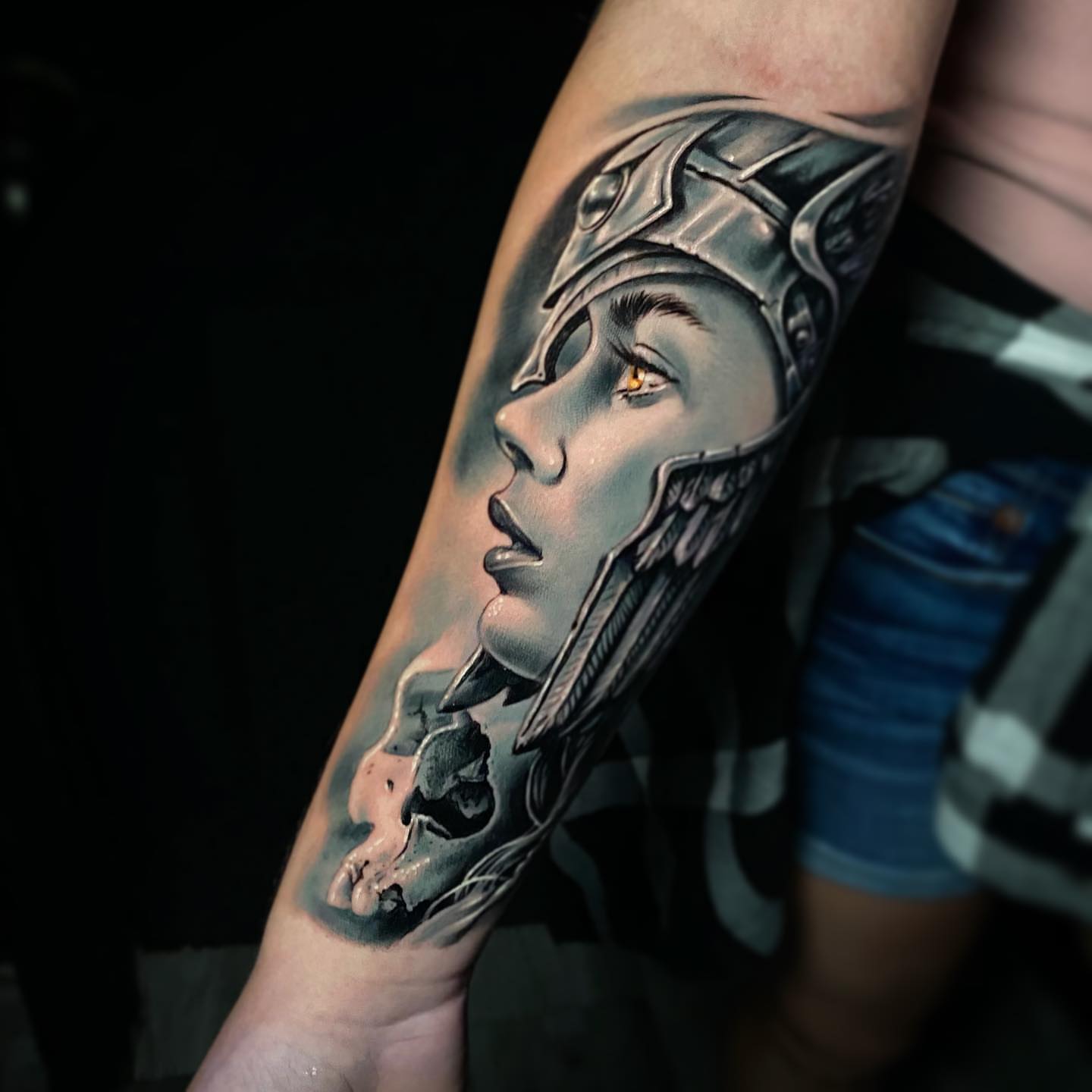 Woman wearing helmet realism tattoo on the forearm by Dayron Gonzalez