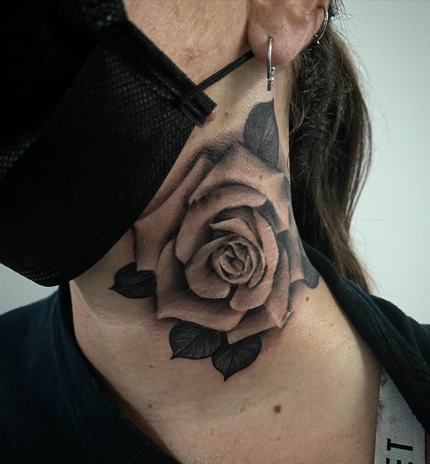 Rose realism tattoo on the neck by Dale DeVille
