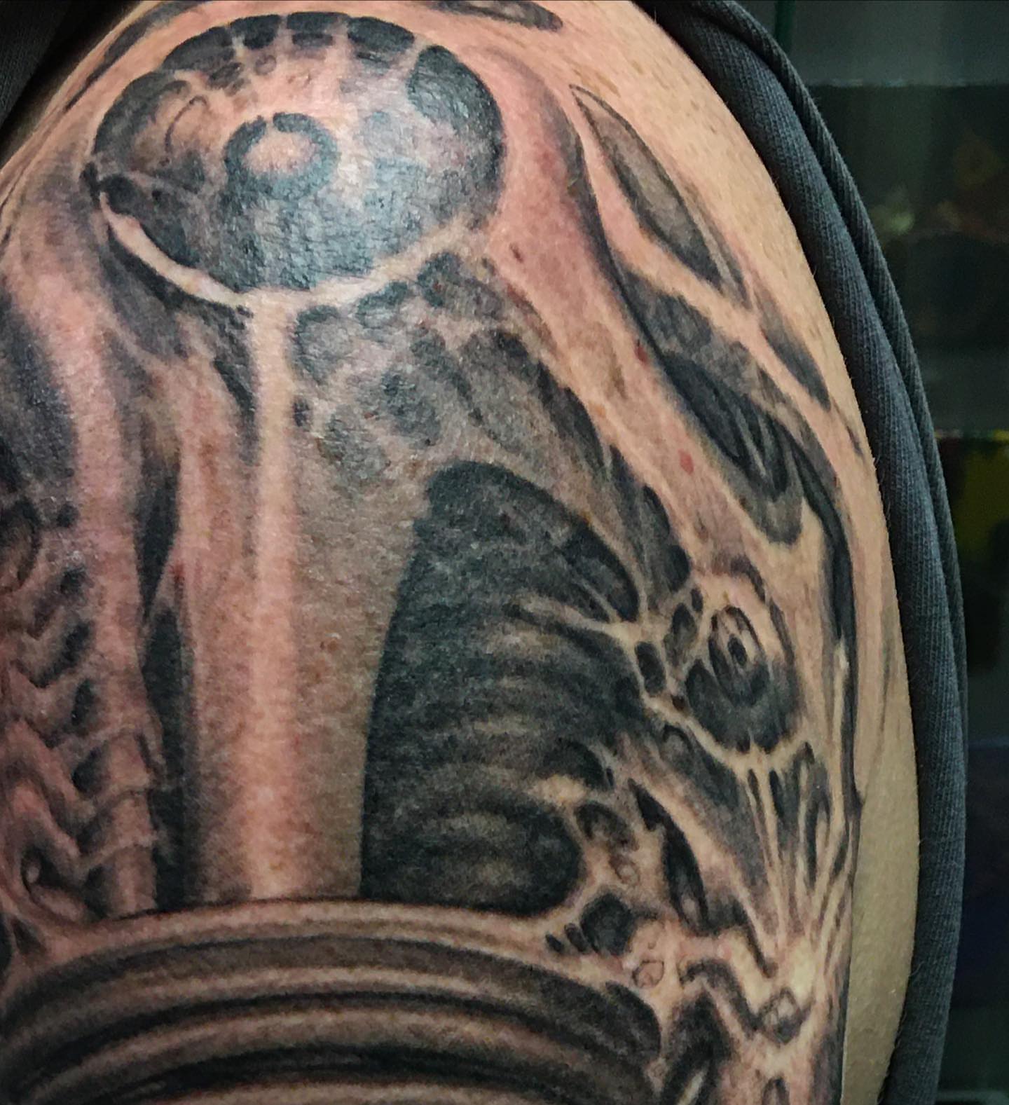 Mechanical gear black and grey tattoo on the shoulder by Shaine Smith, Durham, North Carolina