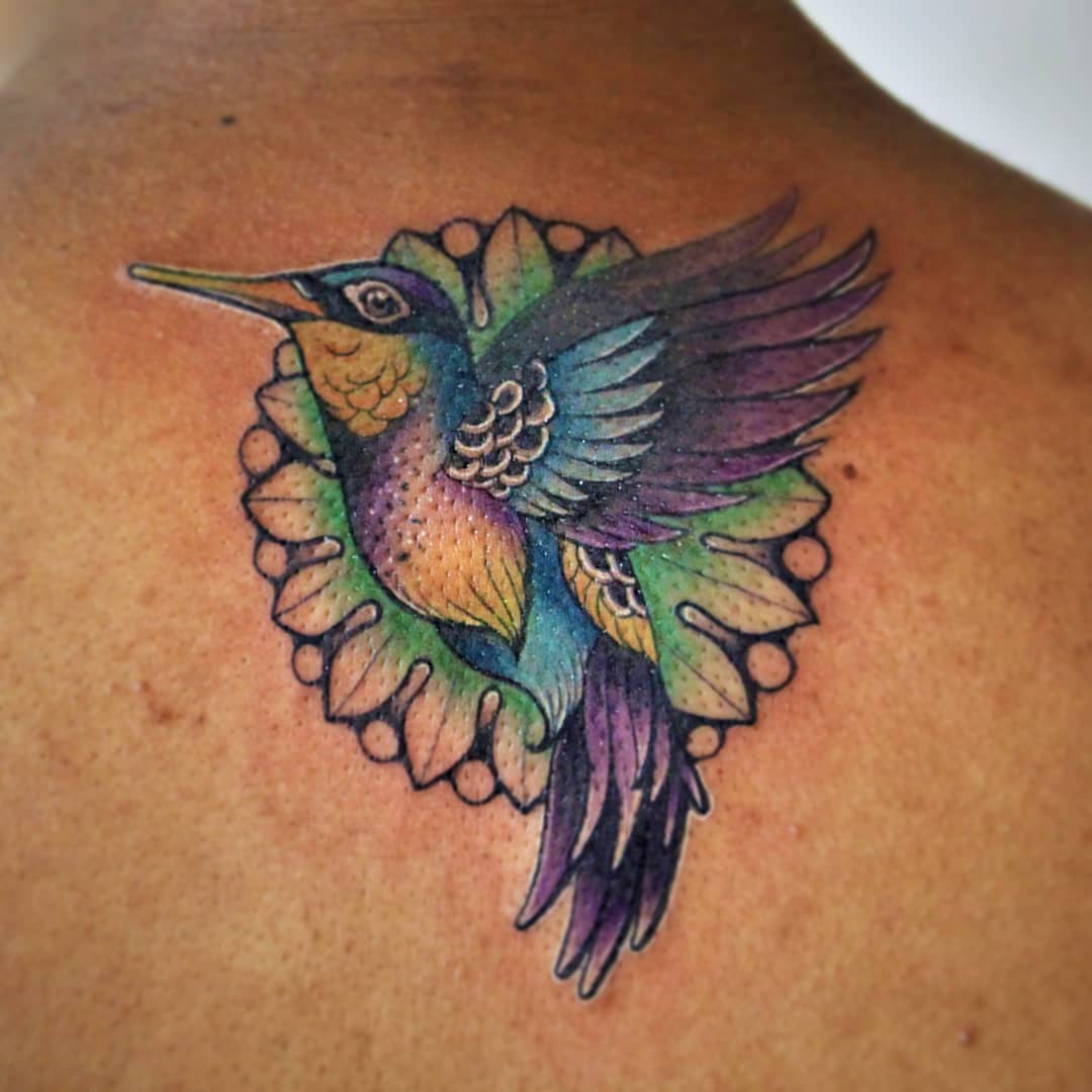 Hummingbird new school tattoo on the back by Luis Chauta