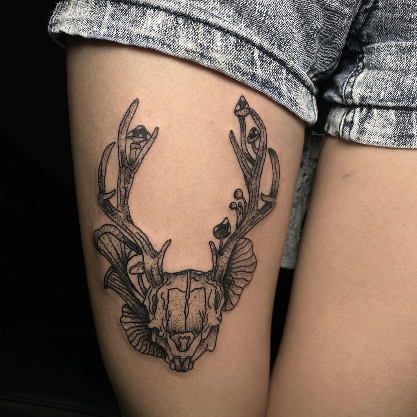 Deer skull dotwork tattoo on the thigh by Syd Cheyenne