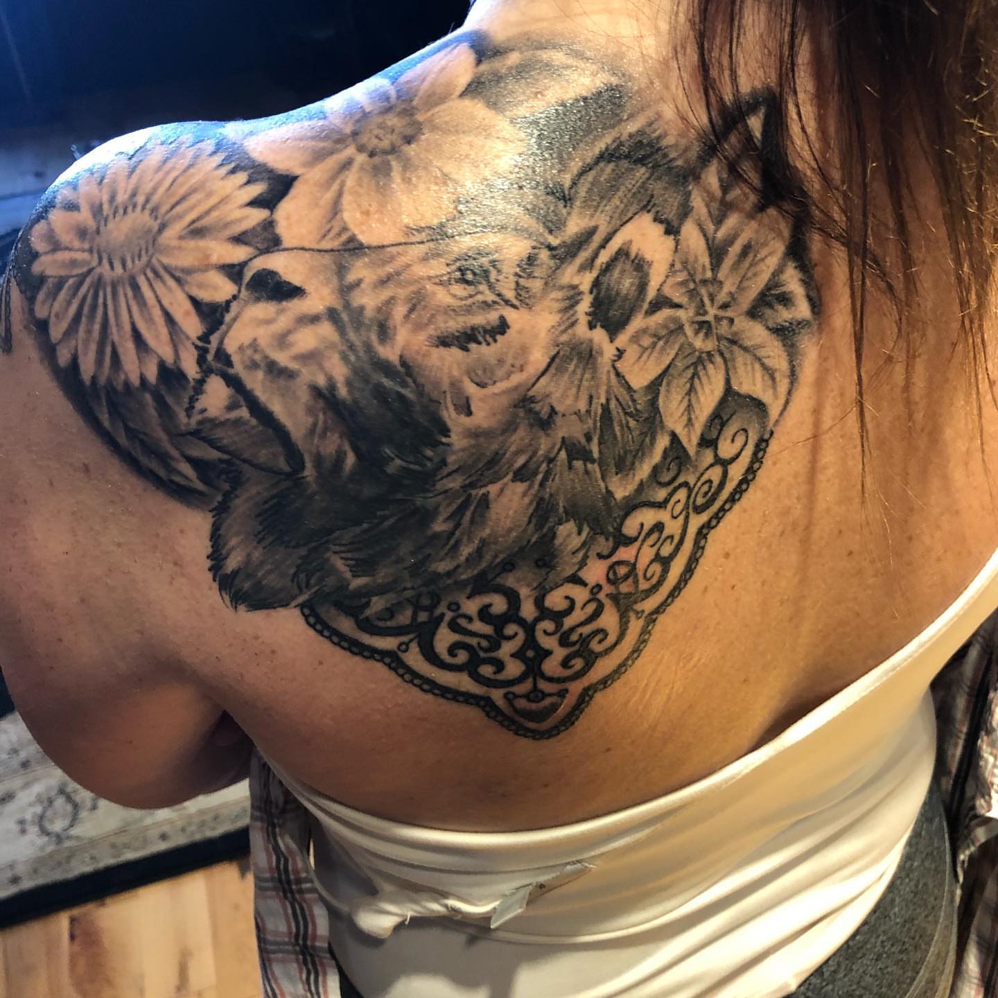 Elephant and floral realism tattoo on the shoulder by A.W.