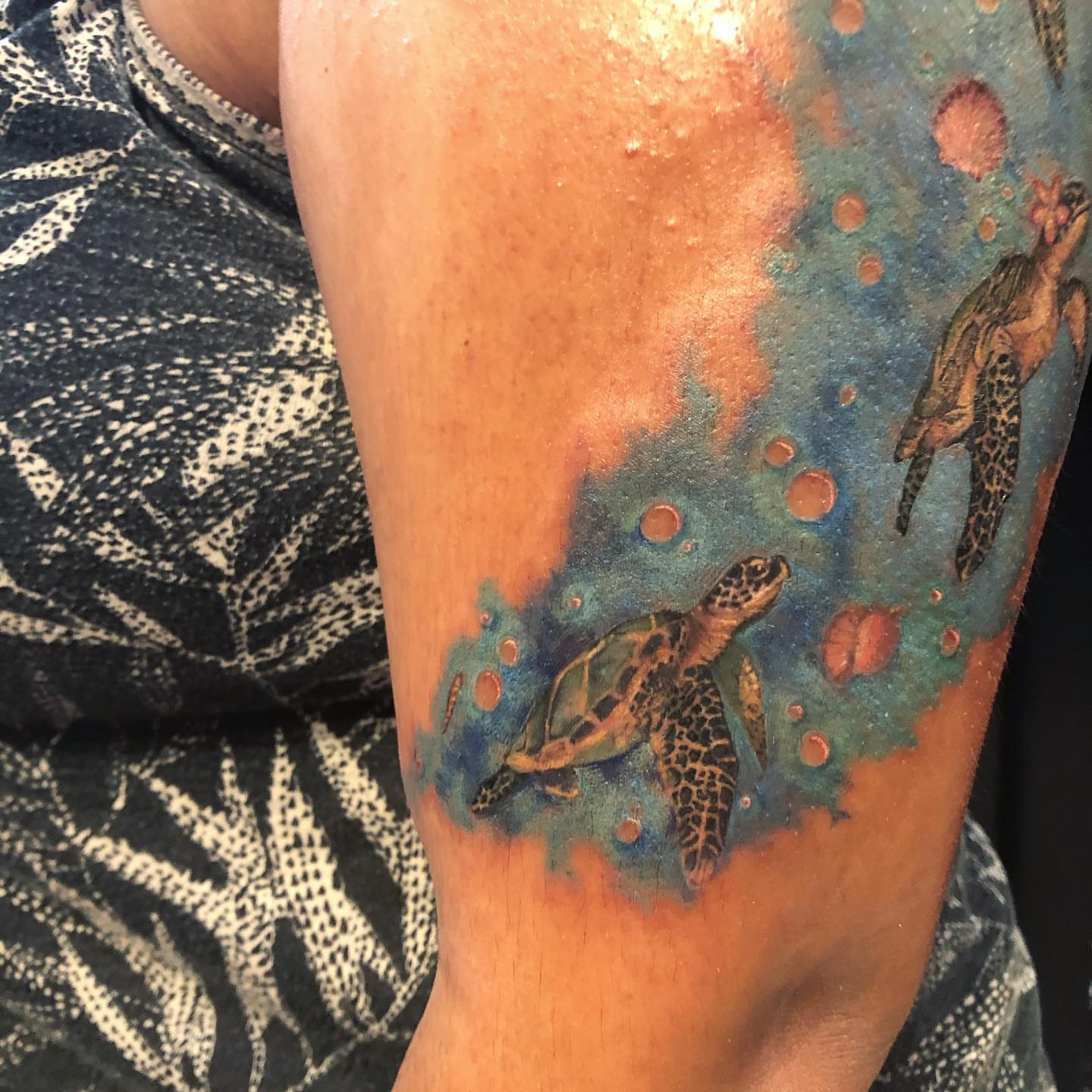 Sea turtles dotwork tattoo on the forearm by Emily Conner