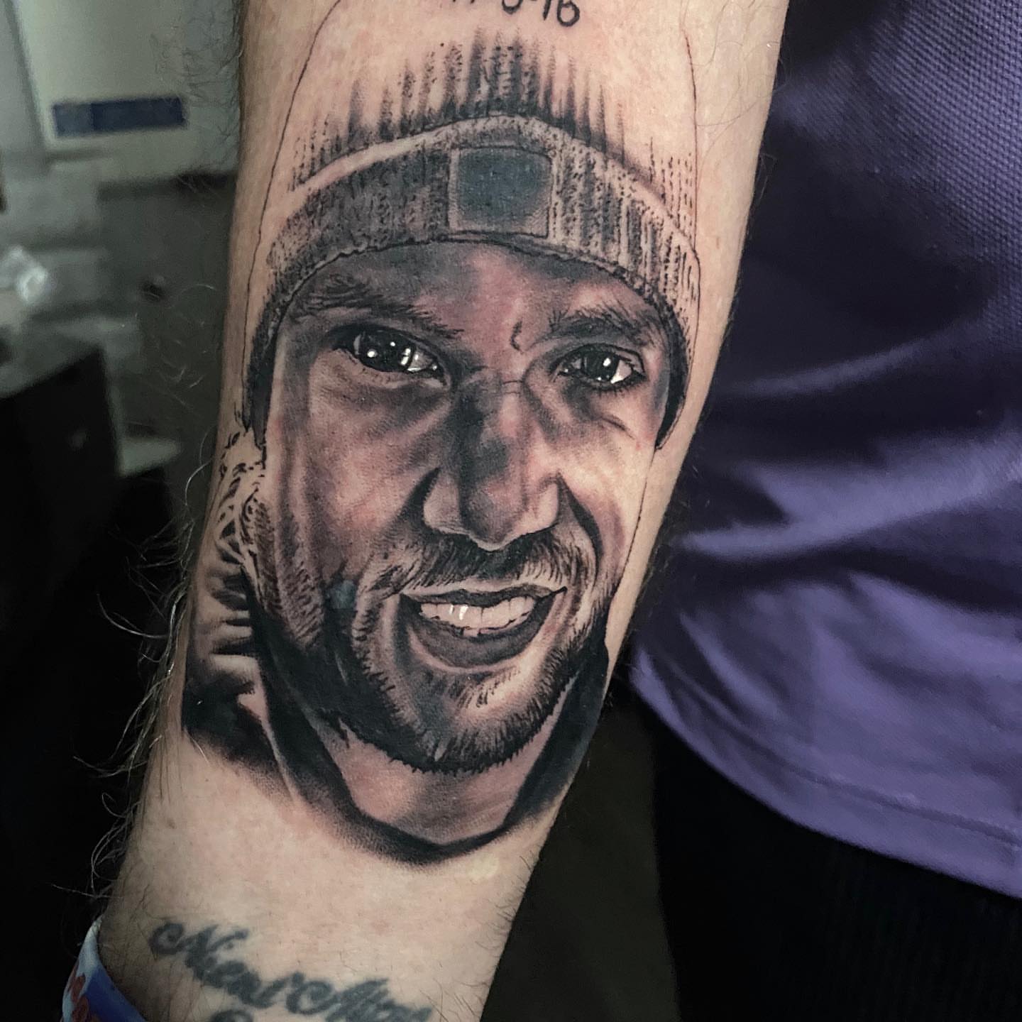 Portrait of a man realism tattoo on the forearm by Brian Cassidy