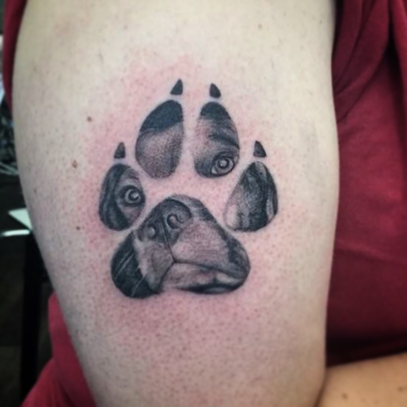 Dog paw print dotwork tattoo on the forearm by Caitlin Curtis Tattoos & Booking, Dayton, Ohio