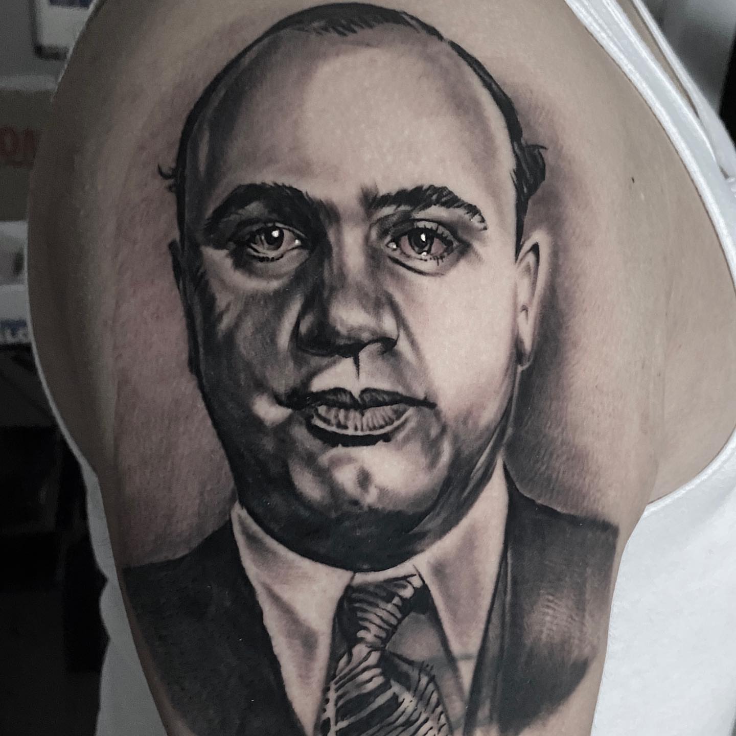 Portrait realism tattoo on the forearm by Brian Cassidy