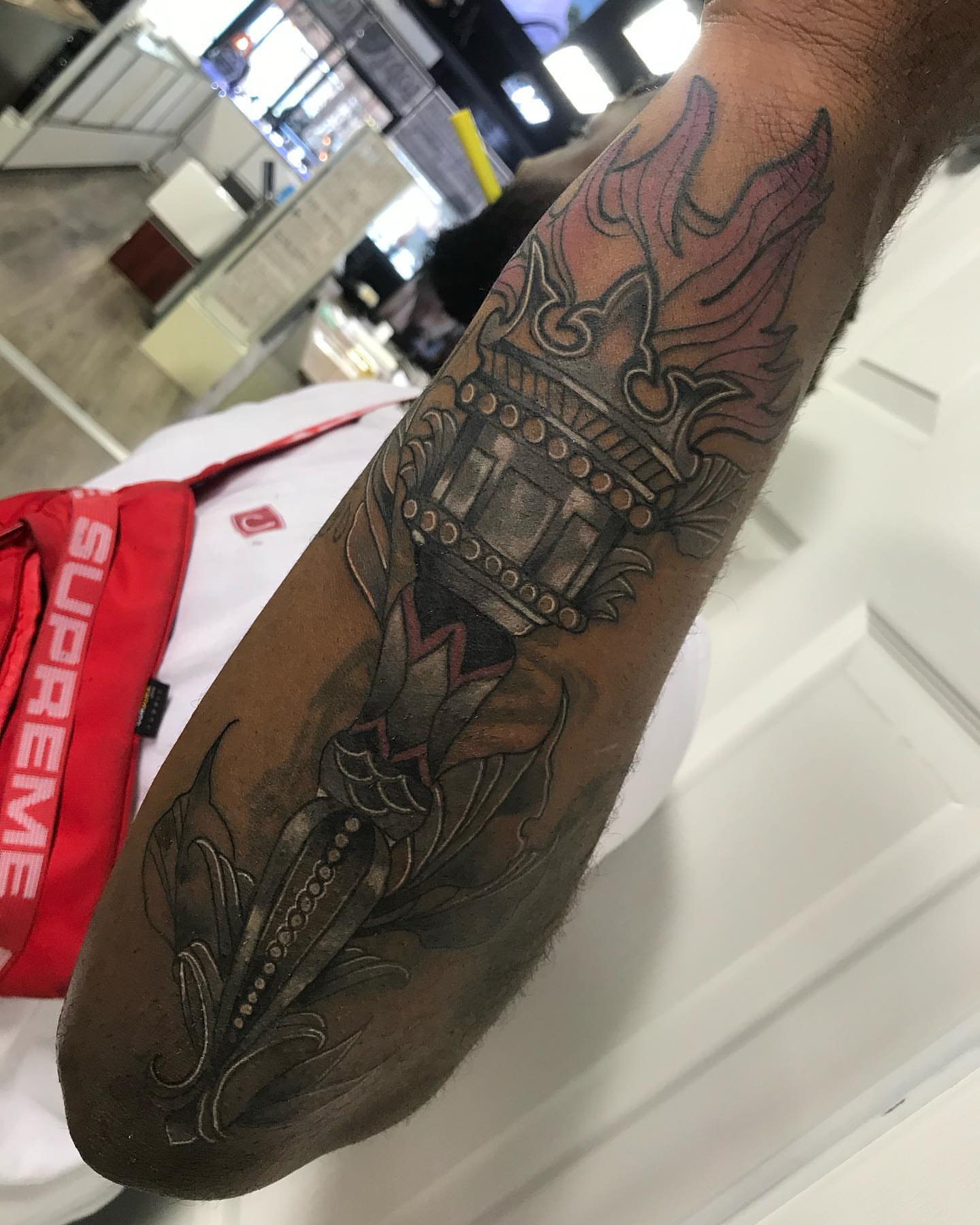 Temple and flames American traditional tattoo on the forearm by Dre Inks
