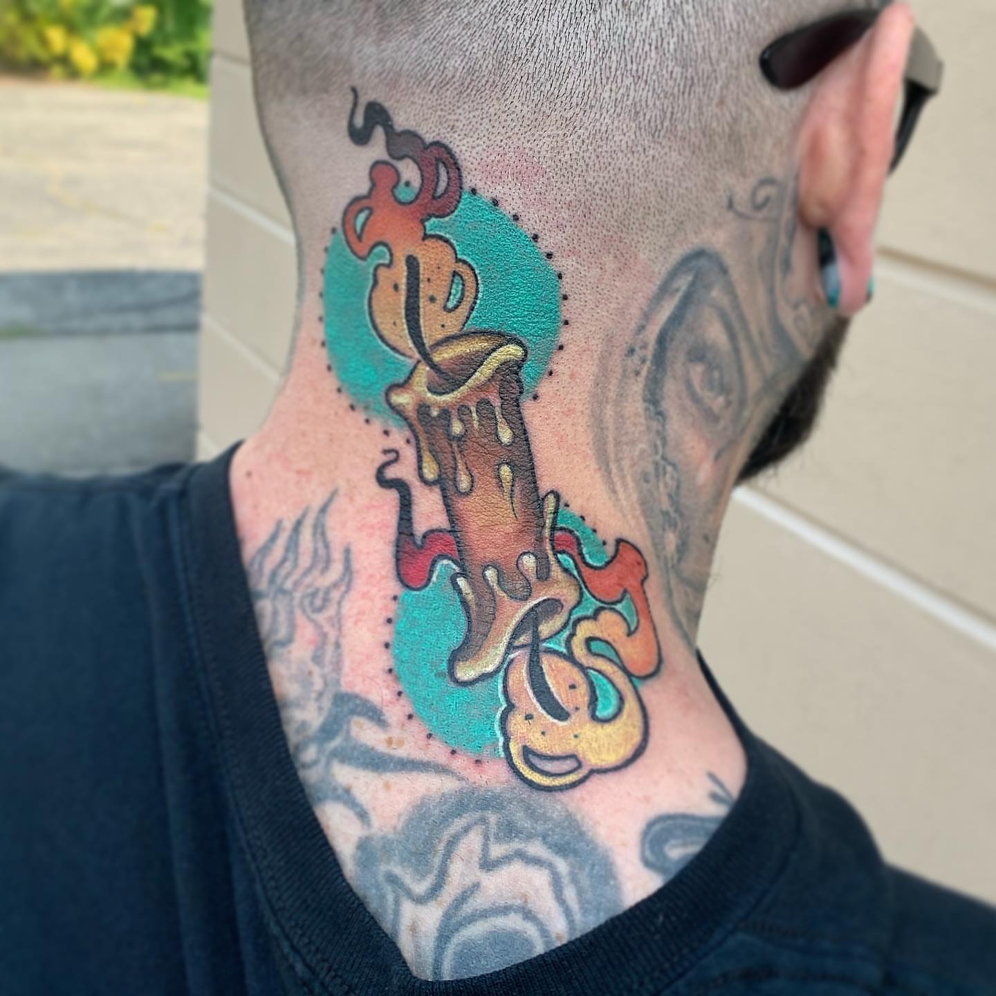 Melting candle new school tattoo on the neck by Paul Hicks