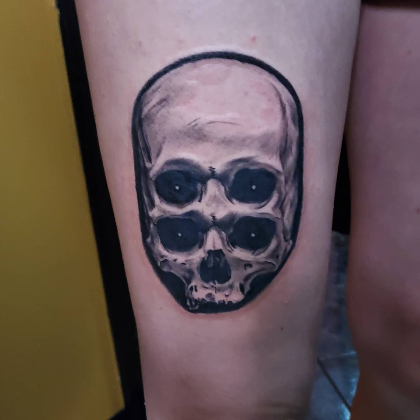 Skull realism tattoo on the forearm by Dan Redding