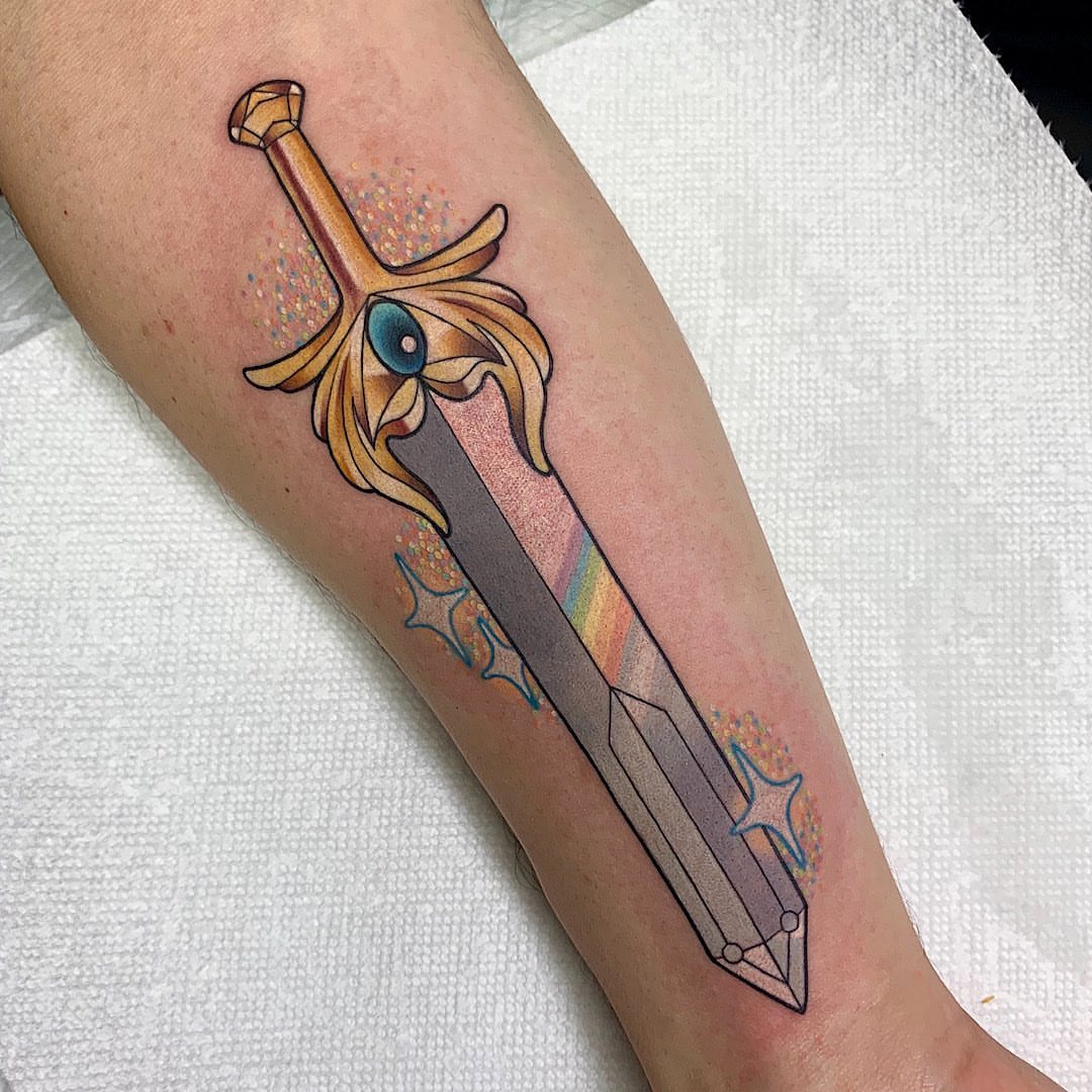 Sword new school tattoo on the forearm by Shelby Ouellette