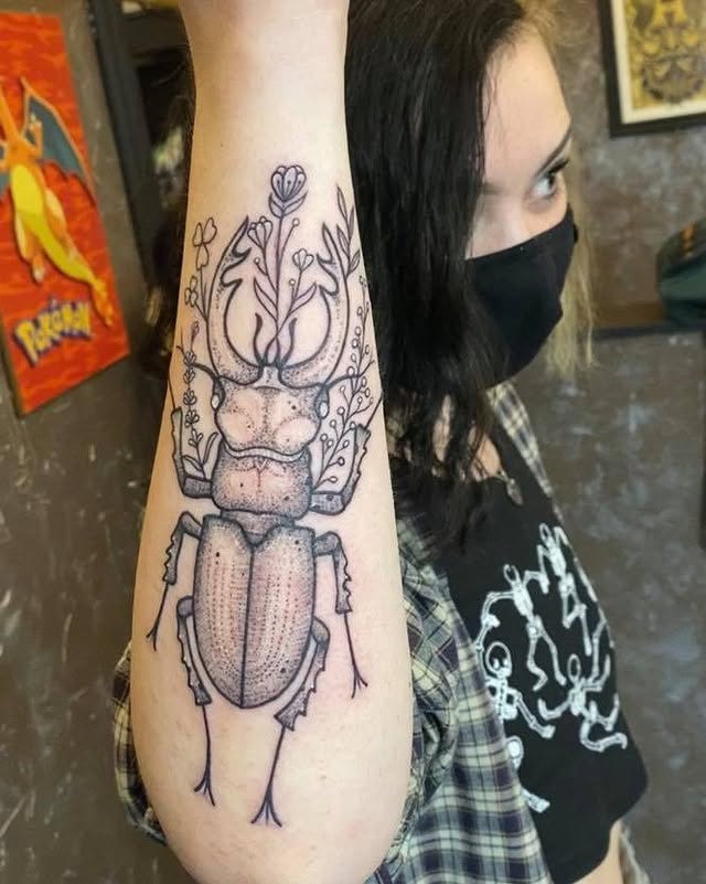 Stag beetle dotwork tattoo on the forearm by Valen Laska